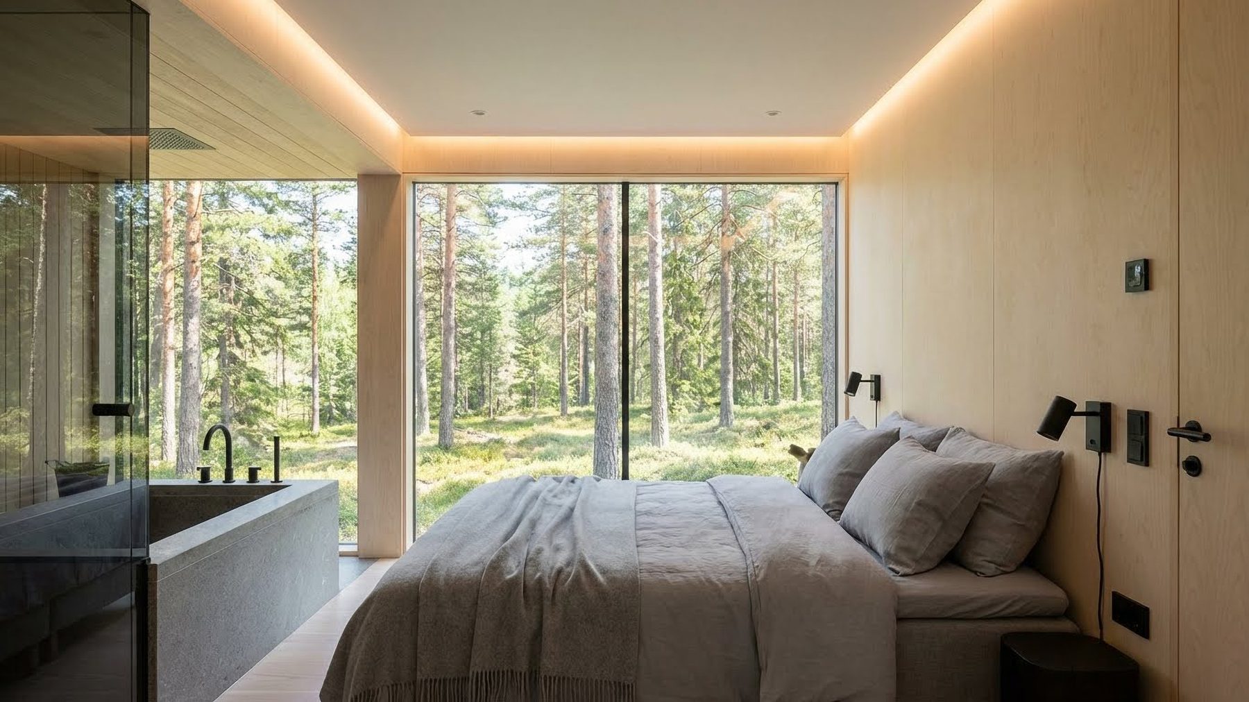 The same bedroom in summer, forest filling the window wall