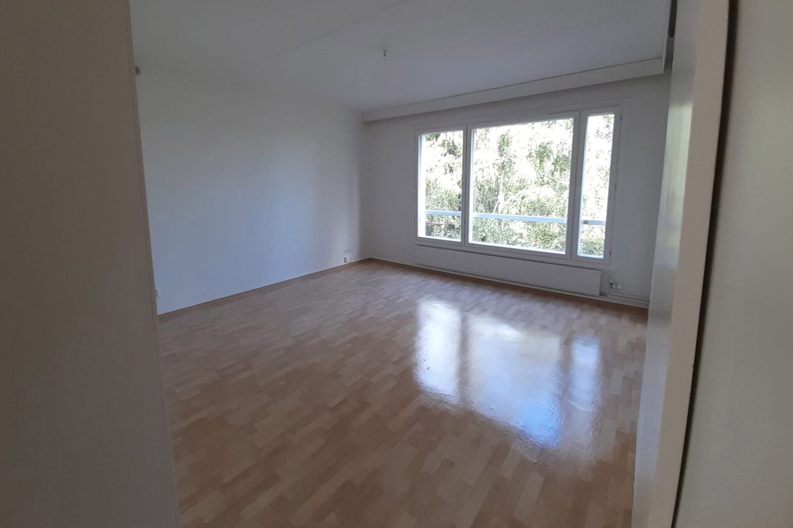 The same living room before staging, empty