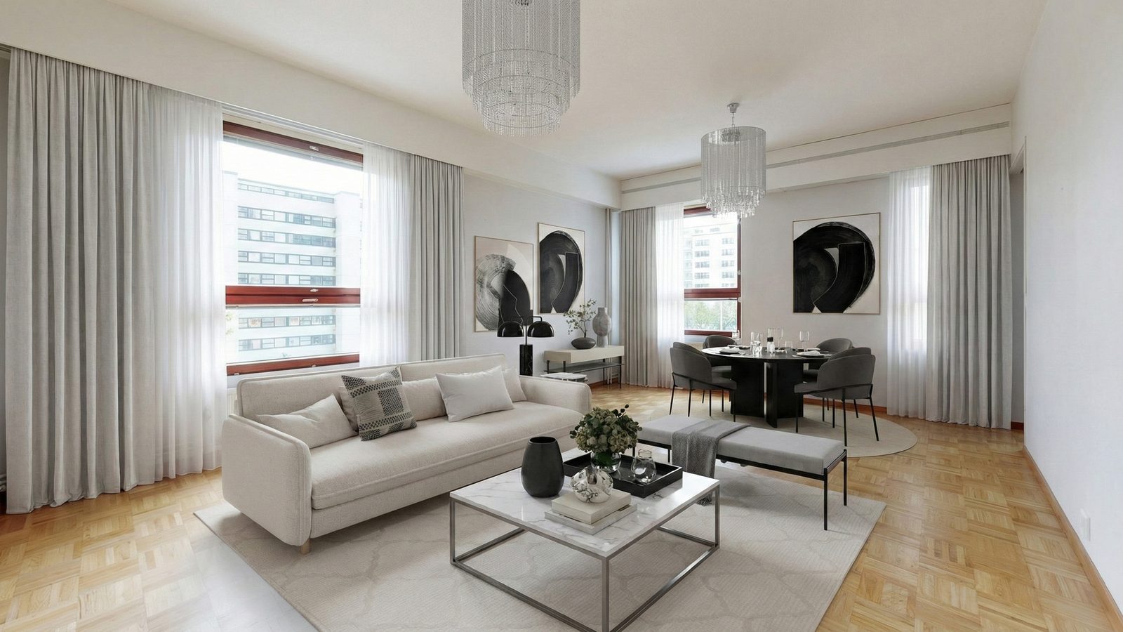 The same room staged in a bright, formal style with chandeliers